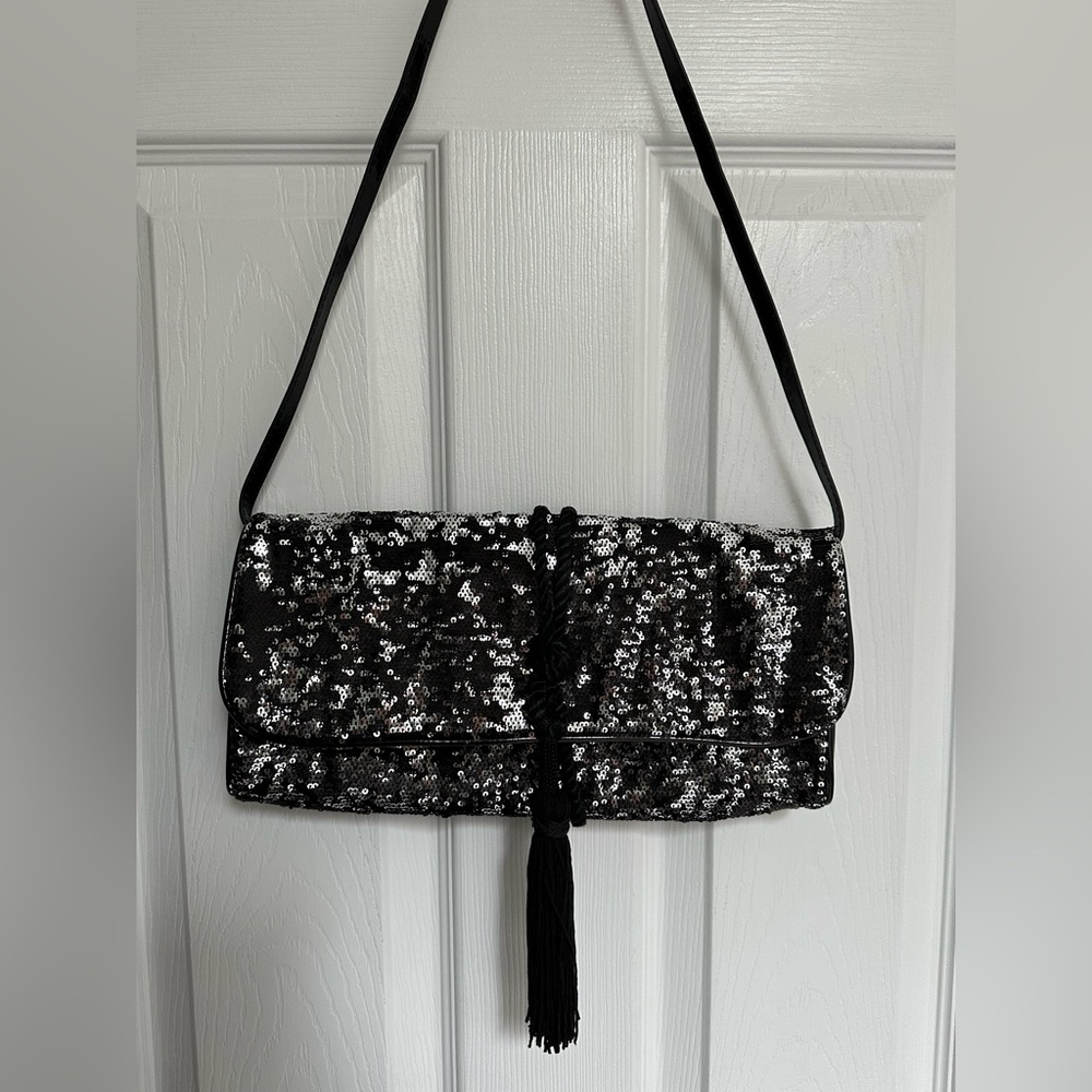 White House Black Market black and silver sequins clutch with removable strap.